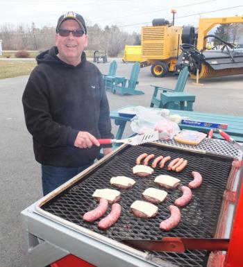 Paul Willis mans the grill serving up burgers and hotdogs to all who attended.