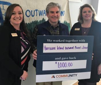 Chris Rokous, Hurricane Island Outward Bound School Development Director (center), with Machias Savings Bank’s Assistant Branch Manager Krista Lopez-Brochu (left) and Mortgage Specialist Rebecca Crane (right).