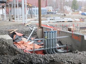 The geothermal pipes waiting for plumbing that will heat and cool the school.