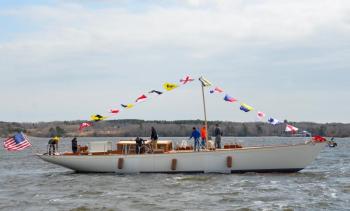 ‘Anna’, the 65-foot cold-molded sloop took her first dip in the St. George River April 2, to a cheering crowd. (Photo by Lynda Clancy)
