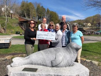 On May 7, the Rockport Garden Club donated $2,500 to the restoration of the Andre the Seal sculpture. The contribution was made to Legacy Rockport, the nonprofit that will collect donations for the $14,000 project. In the photo: Lynda Clancy, of Legacy Rockport, accepts the generous check of the Rockport Garden Club: Gretchen Leone, Susan Cloud, Doris Smart, Kris Mikkelson, and Helen Kuhl. In the back, Select Board members Doug Cole and Mark Kelley, who will oversee the municipal project to get Andre back in shape.