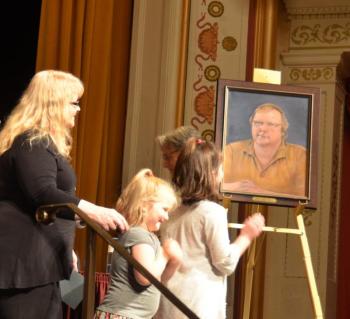 Julie French and grandchildren unveil the portrait of John French, which was painted by Diana Falciani.