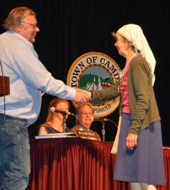 Camden Select Board Chairman John French thanks Beedy Parker for her years of dedication to town environmental work. (Photo by Lynda Clancy)