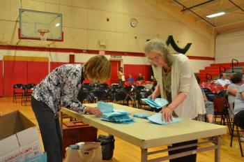 Rockport Assistant Town Clerk and Rockport Town Clerk Linda Greenlaw count ballots. June 11, Camden-Rockport Middle School gym. (Photo by Lynda Clancy)