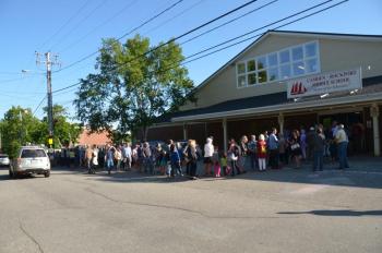 A crowd lines up outside. June 11, Camden-Rockport Middle School gym. (Photo by Lynda Clancy)