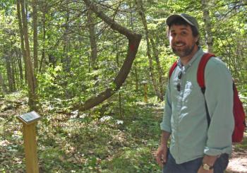 Merryspring’s Nature Center’s Program Director Brett Willard in the Kitty Todd Arboretum, whose grand reopening takes place June 23 at 10 a.m. (Photo by Lynda Clancy)