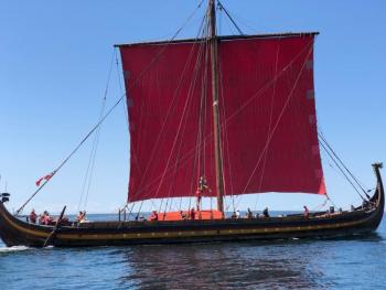 Draken Harald Hårfagre, the life-size working model of a historic Viking Ship, under sail on the approach to Boothbay Harbor, in mid-July. (Photo by A. R. Tandy)