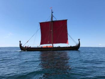 Draken Harald Hårfagre, the life-size working model of a historic Viking Ship, under sail on the approach to Boothbay Harbor, in mid-July. (Photo by A. R. Tandy)