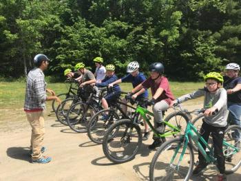 Students at Oceanside Middle School riding to trail building day with Georges River Land Trust. Sidecountry Sports supplied the students with bikes to ride from school to the trailhead.