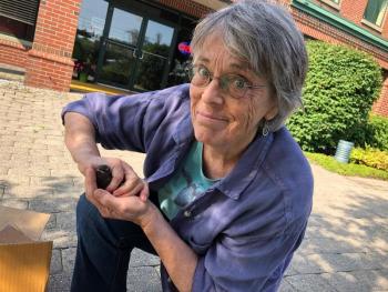 Long time volunteer Selkie O’Meara, of Camden, transports a cedar waxwing from Camden, where it had been rescued on the Rockport waterfront, to Freedom, Aug. 20. (Photo courtesy Lynda Clancy)