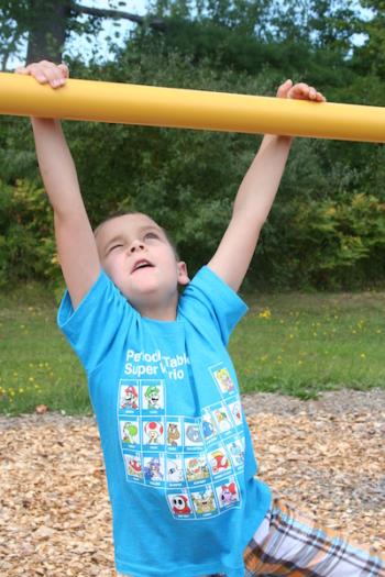 Steven Marriner enjoys playing on the playground. (Photo courtesy Thomaston Grammar School)