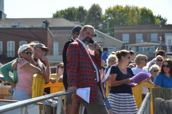 Emcees Seth Silverton, and behind him, Camden Harbor Master Steve Pixley. Jessica Manbeck pulls the whole event together. (Photo by Lynda Clancy)