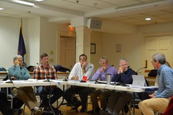 Camden resident Pete Orne, far right, talks about the Raise the Floor legislation with (l-r) Camden Select Board Chairman Bob Falciani, Camden Select Board member Taylor Benzie, Rockport Select Board Chairman Doug Cole, Rockport Town Manager Rick Bates, Camden Select Board member Marc Ratner, and Camden Town Manager Audra Caler-Bell. (Photo by Lynda Clancy)