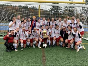 Camden Hills celebrating its third consecutive state championship. (Courtesy Steve Alex)