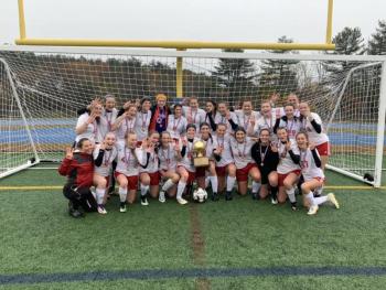 Camden Hills celebrating its third consecutive state championship. (Courtesy Steve Alex)