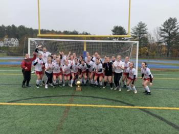 Camden Hills celebrating its third consecutive state championship. (Courtesy Steve Alex)