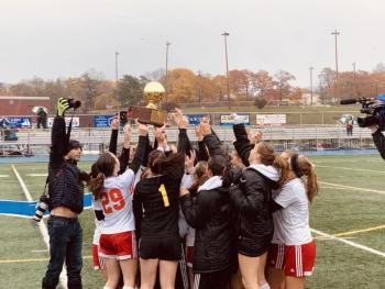 Camden Hills celebrating its third consecutive state championship. (Courtesy Steve Alex)
