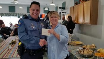 Rockport Police Officer Chris Taylor was one of the raffle prize winners. (Photo by Sarah Shepherd)
