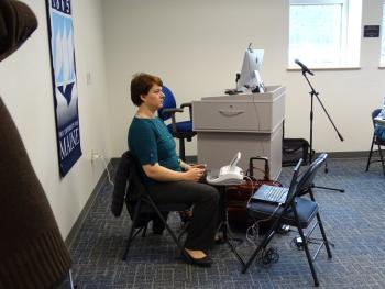 A court reporter painstakingly took minutes of the meeting. (photo by Erica Thoms)