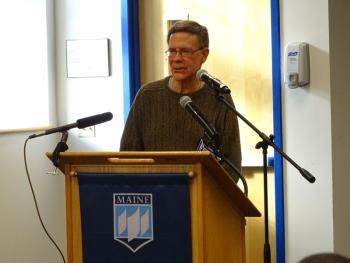 Doug Welldon, who has family roots on the island, speaks to the crowd. (photo by Erica Thoms)