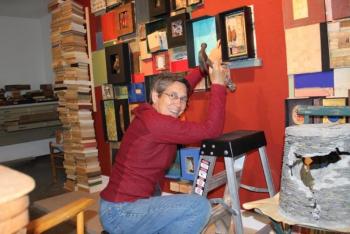 Read installing her installation “Library.” (Photo courtesy Abbie Read).