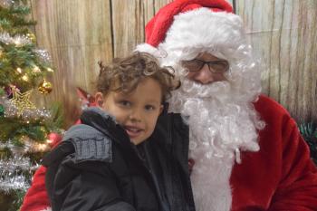 Legare Cuyler sits with Santa Clause during a school children’s shopping trip. (Photo courtesy of Thomaston Grammar School)