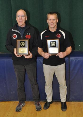Patrick Kelly and Perry Goodspeed collected their 300th coaching victories Dec. 15 and were recognized for the achievement following the meet. (Courtesy Glenn Lang)