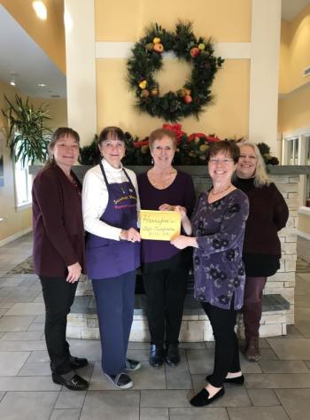 Present for the donation, given in the form of Hannaford gift cards, were (left to right) Heidi McCaffrey, VP of Hospice at Sussman House; Leigh Smith, Sussman House Volunteer and founder of ‘Ringing in the Season’; Joy Chamberlin, Volunteer Coordinator, Maine HealthCare At Home; Amy Rollins, ‘Ringing in the Season’ concert organizer; and Betsy Boynton, R.N.-CHPN, Sussman House Manager. (Photo courtesy of Ringing in the Season)