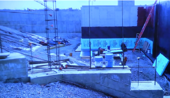 View of a retaining wall and waterproofing of the foundation on the new CRMS building on Knowlton Street (Source: YouTube)
