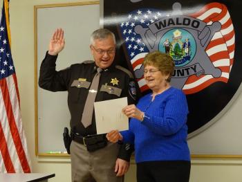 Sheriff Jeffrey Trafton is sworn-in for his second term as sheriff with Irene Blood, who worked with District Court for 30 years before retiring. (photo by Erica Thoms)