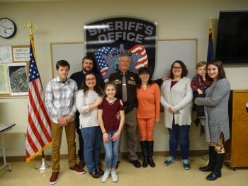 Trafton poses with his family, including (left to right) grandson Caden Gurney, daughter Amanda Gurney, son-in-law Jake Gurney and granddaughter Lydia Gurney. On the other side of Trafton is wife Wendy, and daughters Lindsay Page and Britney Mayer, who is holding her son Lincoln. (photo by Erica Thoms)