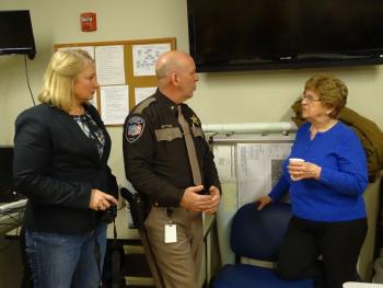 Chief Deputy Jason Trundy and his wife Lorraine talk with Irene Blood after the ceremony. (photo by Erica Thoms)