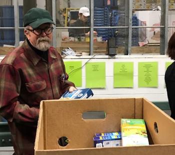 Rep. Paige Zeigler sorts items at Good Shepherd Food Bank. (Photo courtesy of Vicki Doudera)