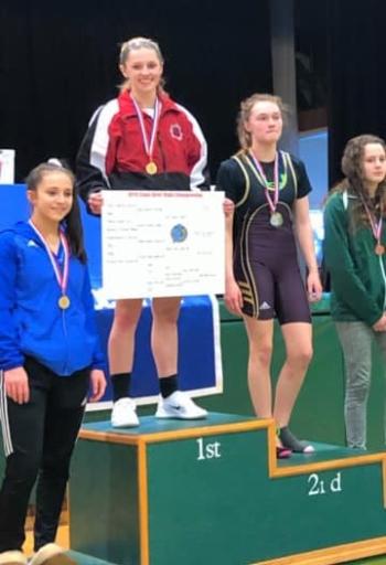 Kristina Kelly on the podium for her state championship victory. (Courtesy Steve Alex)