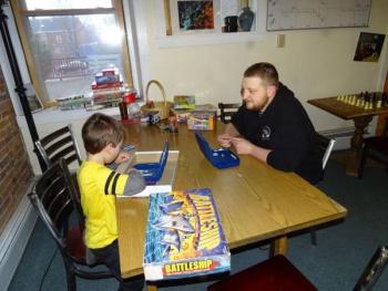 I Know ME Program Manager Stephen Colby plays with a staff members child. (photo by Erica Thoms)