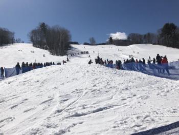 The lower part of Half Hitch at the Camden Snow Bowl was festive March 17 for many reasons. (Photo by Lynda Clancy)