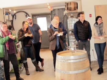 A group of 10 people listened to the distillery’s presentation while enjoying the hors d’ouevres.