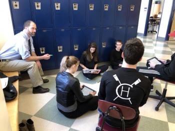 Rep. Pluecker listens to US History students discuss US foreign policy. (Photo courtesy Camden Hills Regional High School)