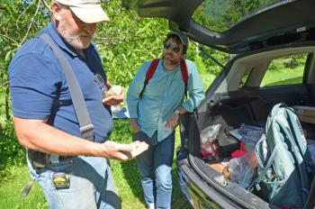 Harbour Mitchell, Union archeologist, and Merryspring’s Nature Center’s Program Director Brett Willard take a look at the latest findings from an old settlement in May 2018. (Photo by Lynda Clancy)