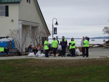 Chaperones stand watching the teenage volunteers. (photo by Erica Thoms)