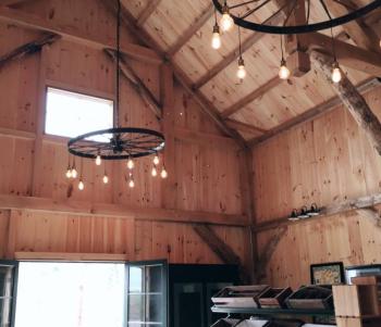 Handmade chandeliers with upcycled wagon wheels inside the Wild Grace Farm Store. (Photo courtesy of Wild Grace Farm)
