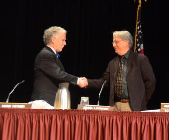 Select Board Chairman Bob Falciani congratulates Marc Ratner on his reelection. (Photo by Lynda Clancy)