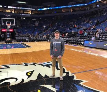 Will Hyland on the court of the Target Center, the home arena of the Minnesota Timberwolves and Minnesota Lynx, during his shadowing experience. (Courtesy Will Hyland)
