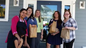 Dee Patel’s coworkers at Pen Bay Skin Care in Rockport took several takeout bags back to their office on opening day, June 7. (Photo by Sarah Shepherd)