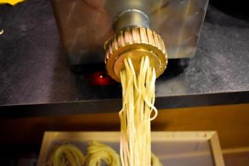 The pasta going through the extruder. (Courtesy Nick Grim)