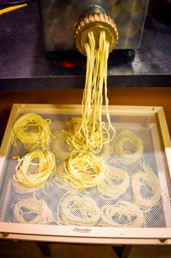 The pasta going through the extruder. (Courtesy Nick Grim)
