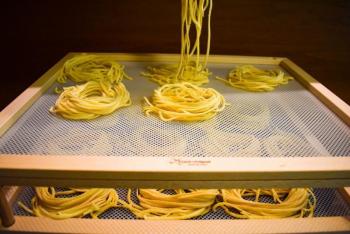 Some pasta is put into nests for a 24 hour drying period. (Courtesy Nick Grim)