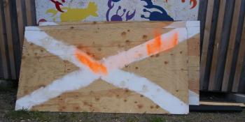 Waterfall Arts had multiple items spray-painted orange, from a rock bench to picnic tables, even several flowers were painted orange. (photo by Erica Thoms)