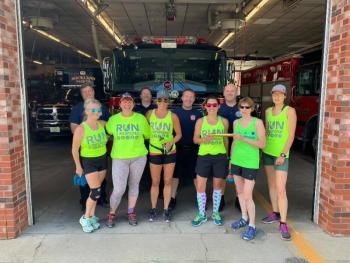 Stage 14 transition point at the Rockland Fire Station. Front row, L-R: Mary Smith, Doug Johnstone, Beth Wilkas Feraco, Jala Tooley, Theresa Withee, and Frances Killea. Back row: Asst. Fire Chief Adam Miceli, Firefighter Rusty Barnard, Firefighter Max Negley, and Lt. Patrick Lowe. (Photo courtesy Run2Respond)