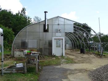 The greenhouse has been stripped of its plastic. (photo by Erica Thoms)